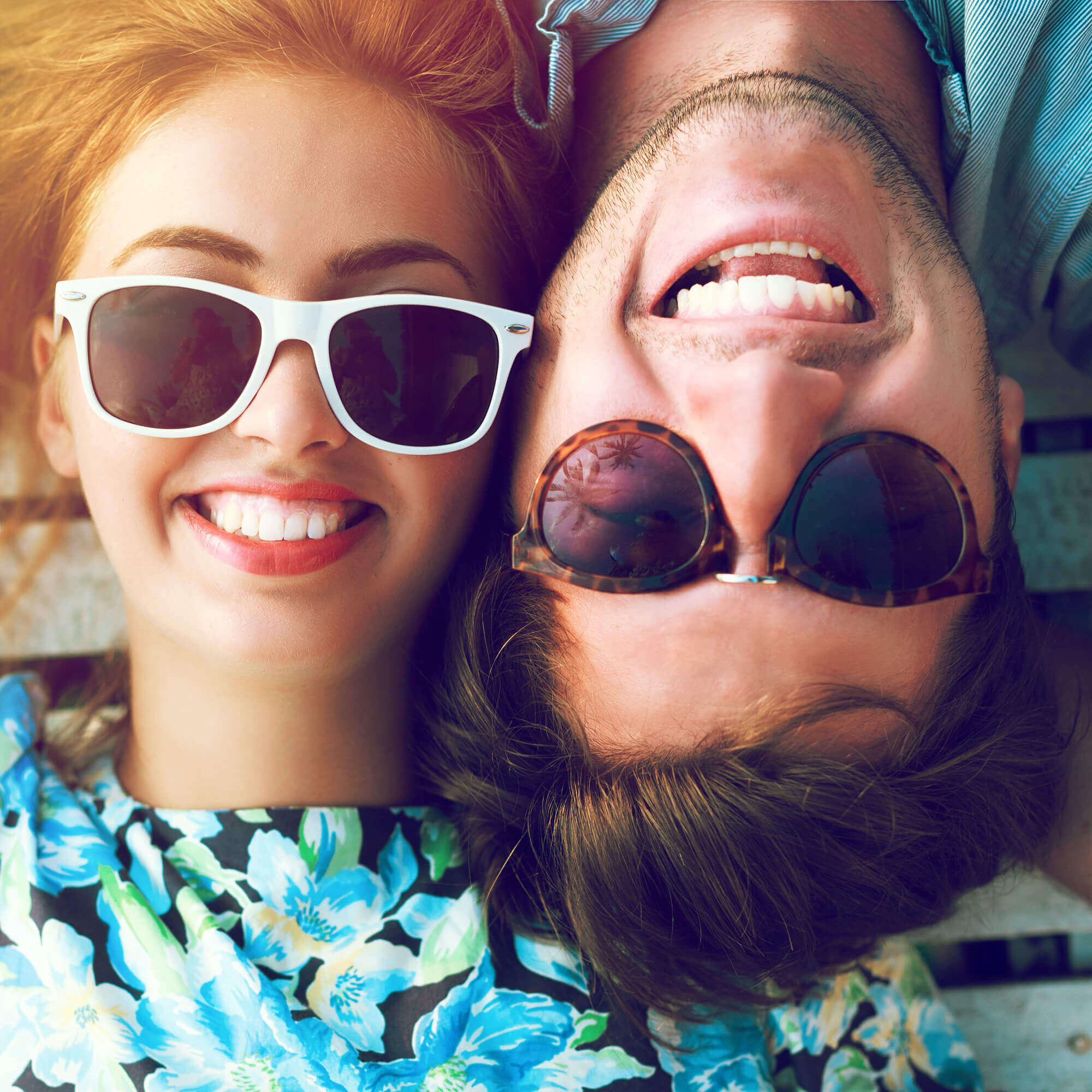 happy couple with bright, white smiles