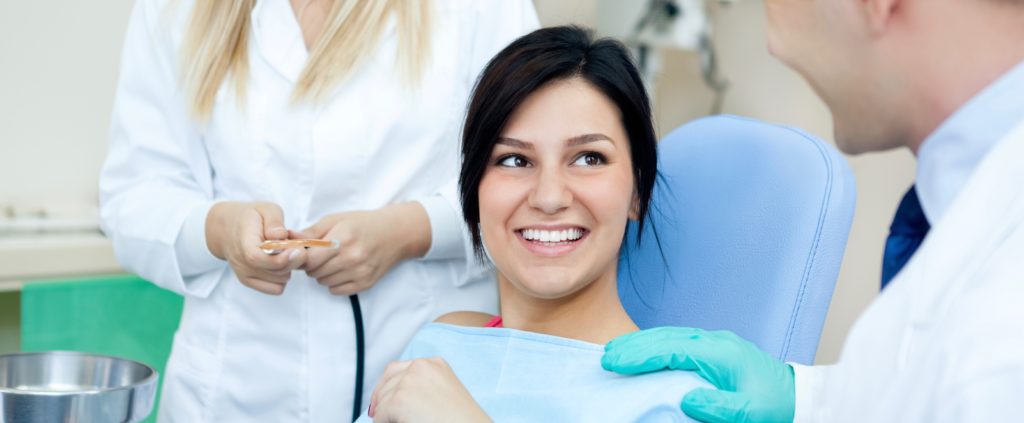 smiling woman sitting in a dental chair