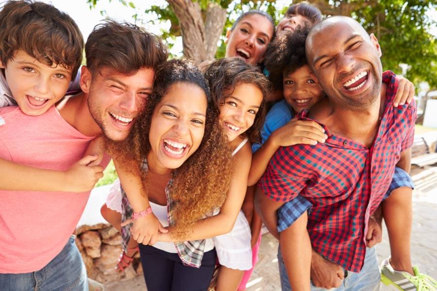 Family and friends smile after receiving family dental care at their family dentist in Gastonia, NC