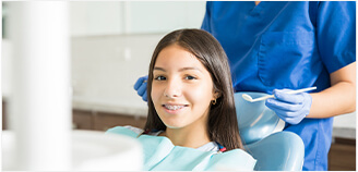 girl sitting in a dental chair